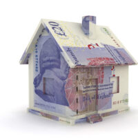 A model home made from banknotes